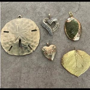 Lot of five pendants. Small heart is a locket.